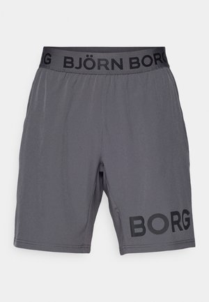 Tamsiai pilki sportiniai šortai su elastingu juosmeniu, ant kurio yra užrašas "BJÖRN BORG", o kairiajame šortų krašte išspausdintas žodis "BORG".
