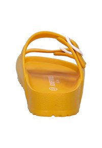 Yellow sandal with a textured sole, two ankle straps, and a white accent strap. Back view shows smooth material and size label.