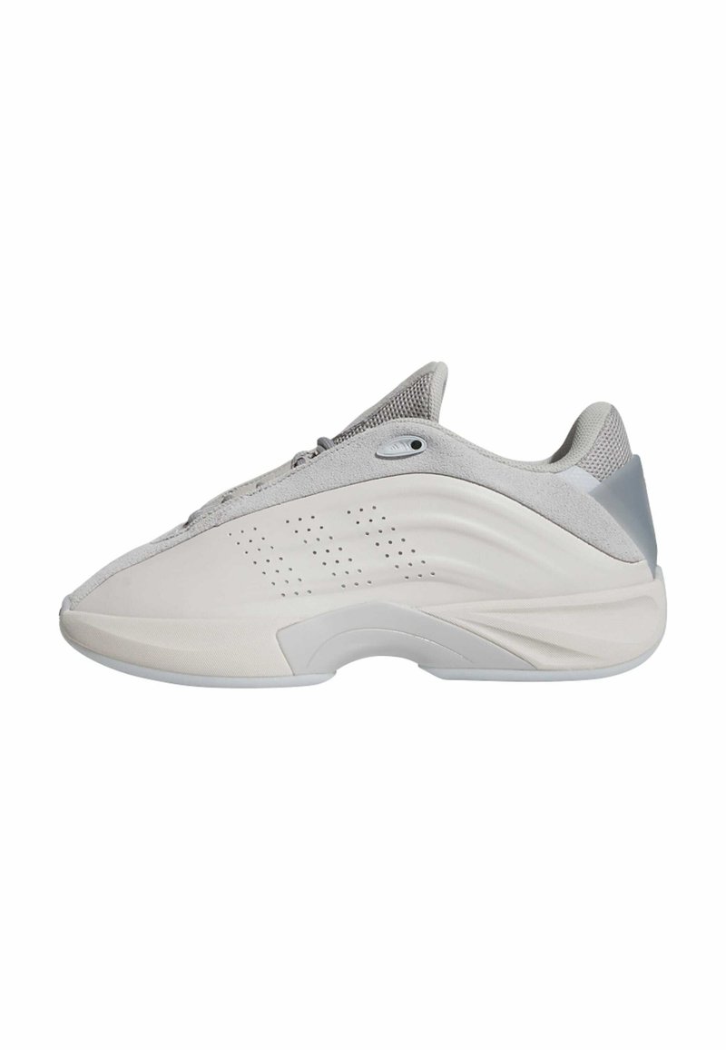 Light gray athletic shoe with a textured upper, rounded toe, and a curved sole. Features perforated detailing and a reinforced heel.