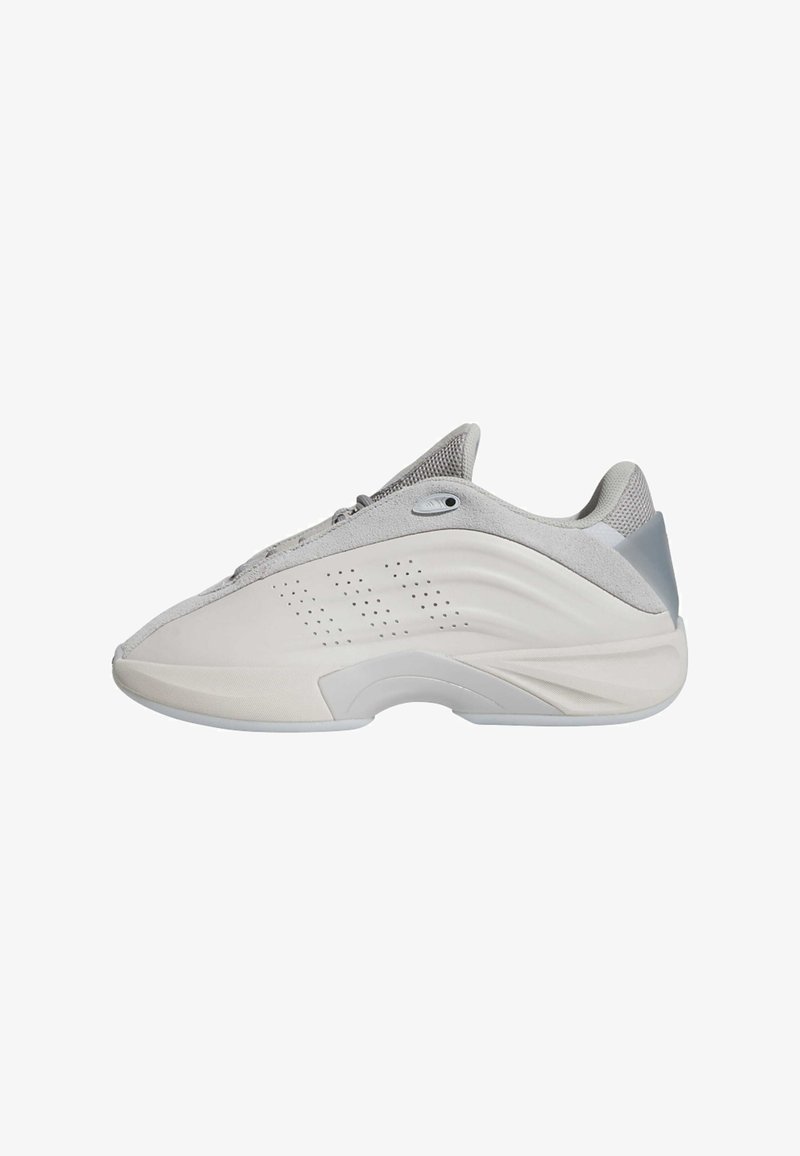 Light gray athletic shoe with a textured upper, rounded toe, and a curved sole. Features perforated detailing and a reinforced heel.