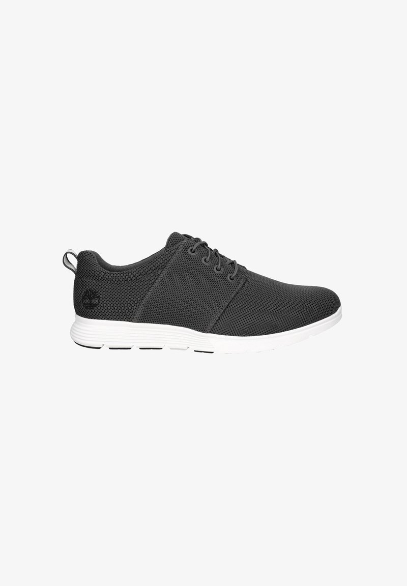 Black mesh sneakers with a textured upper, white sole, and contrasting black accents. Features laces and a pull tab on the heel.