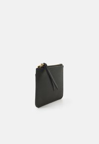 Black zippered pouch made of textured material, featuring a gold zipper and a leather pull tab, square shape with rounded edges.