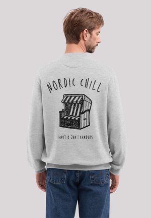 Gray crewneck sweatshirt features an illustration of a beach chair and text "NORDIC CHILL" on the back. Ribbed cuffs and hem.
