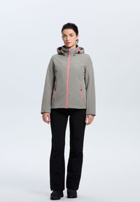 Light gray softshell jacket with a hood, featuring pink zippers and accents. Worn with black pants and black footwear. Smooth texture.