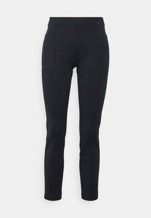 Pantalons noirs ajustés en matériau extensible avec une texture lisse, dotés d'une taille haute et de jambes fuselées pour une silhouette élégante.