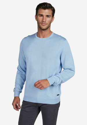 Light blue knit sweater with long sleeves and round neck, featuring ribbed cuffs and hem, and a small branding detail on the lower side.