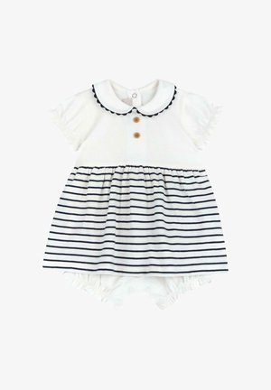 Witte katoenen jurk met marineblauwe strepen, ronde kraag en korte gerimpelde mouwen. Voorzien van twee houten knopen en een elastische onderkant.