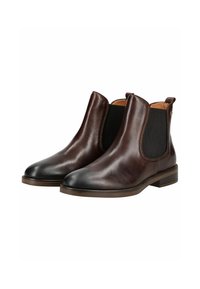 Botas Chelsea de cuero marrón con paneles elásticos en los laterales, punteras redondeadas y sutiles detalles de costura. Acabado suave con suelas de goma resistentes.