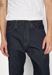 Carhartt WIP PONTIAC PANT MAITLAND - Tiesaus kirpimo džinsai - blue one wash