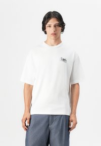 White cotton t-shirt with short sleeves and a crew neck. Features a small black graphic of mountains and a sun on the left chest.