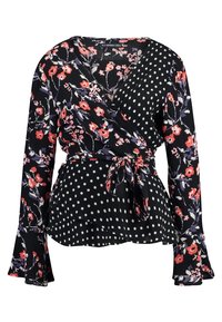 Musta kietaisupaita, jossa on kukkakuvio ja pilkkuja. Pitkät hihat, peplum-muotoilu ja vyötäröllä solmimisominaisuus. Kangas vaikuttaa kevyeltä.