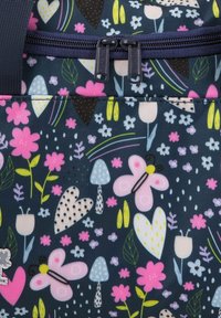 Navy fabric backpack featuring colorful floral and butterfly patterns, with pink, green, and white accents, double zipper closure, and textured design.
