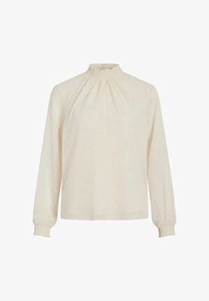 Langermet kremfarget bluse med smocket høy hals, teksturert stoff med små prikker og elastiske mansjetter for en avslappet passform.
