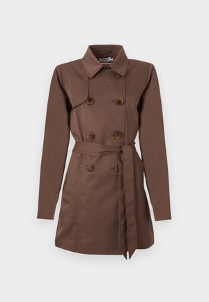Brown trench coat with double-breasted front, large brown buttons, belted waist, and long sleeves, crafted from smooth fabric.