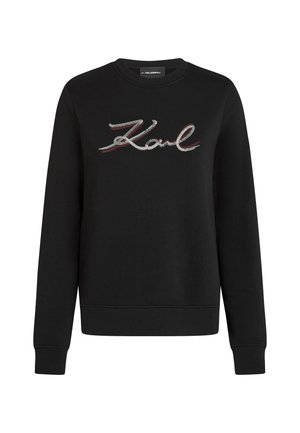 Black long-sleeve sweatshirt with a round neck, featuring the word "Karl" in sequined cursive text across the chest.
