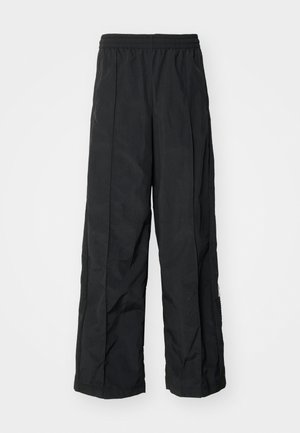 Black wide-leg pants with an elastic waistband, featuring a smooth texture and side seam detailing for added design.