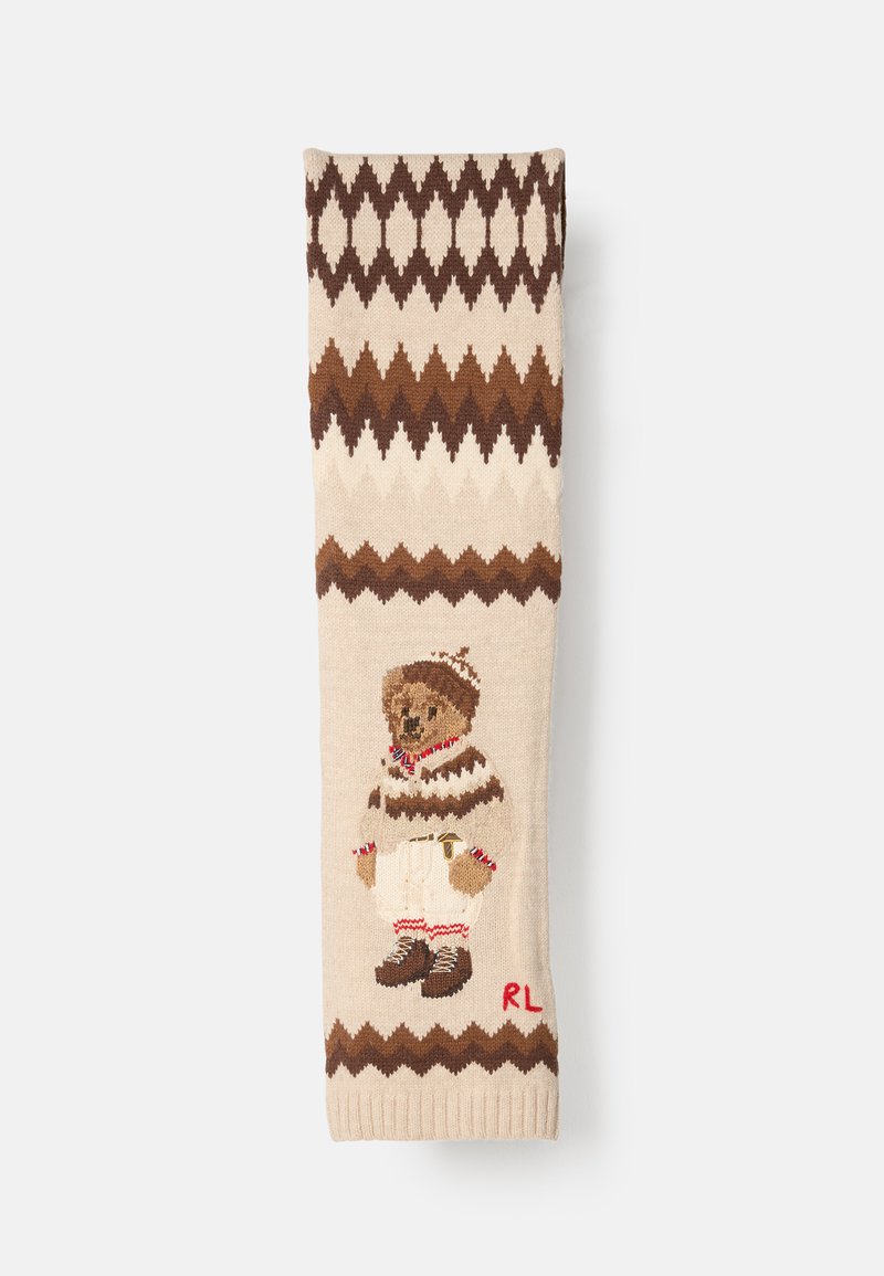 Sweater de malha com base em tons de bege e padrões zigzag castanhos. Urso de peluche bordado com um suéter segura um sino, com "RL" vermelho na parte inferior.