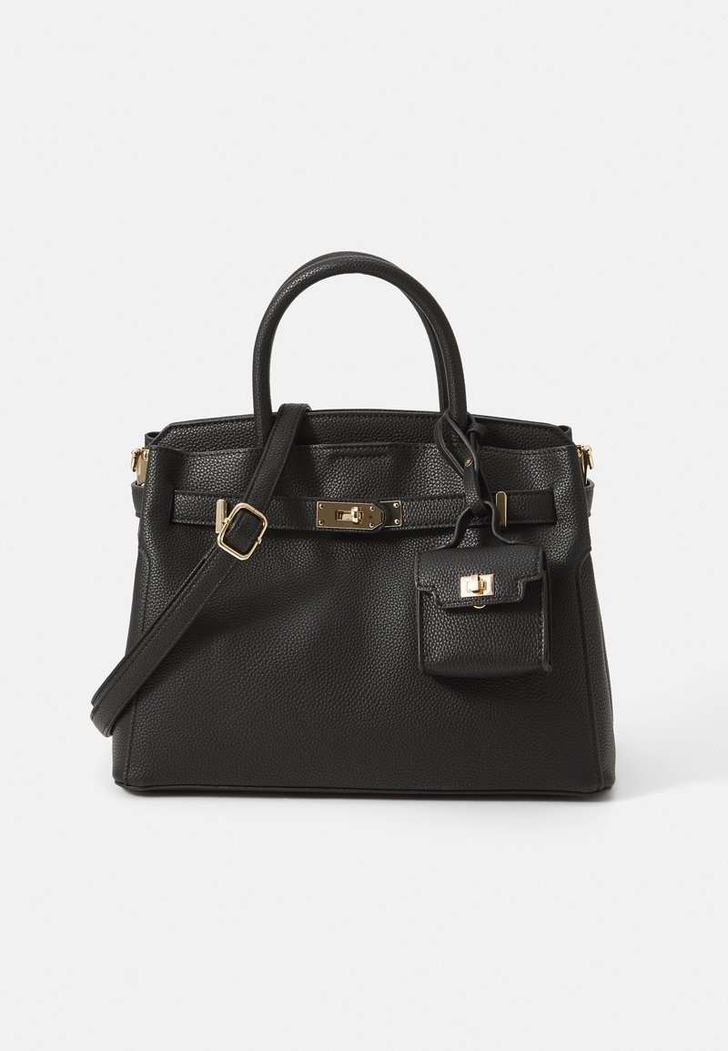 Schwarze Lederhandtasche mit strukturiertem Oberflächen, oberen Tragegriffen und einem abnehmbaren Schulterriemen. Mit goldfarbenen Beschlägen und einem kleinen angebundenen Beutel.
