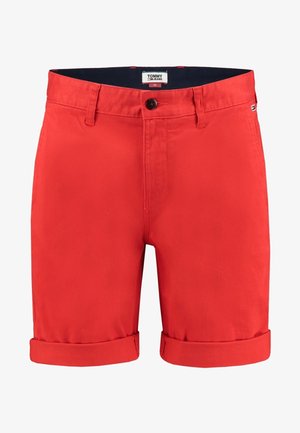 Pantalones cortos informales de algodón rojo con dobladillos enrollados, cierre de botones, trabillas para cinturón y etiqueta de Tommy Jeans en el interior de la pretina.