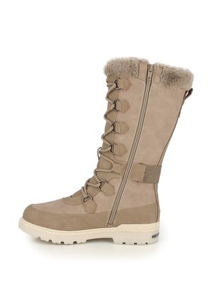 Botte d'hiver beige avec doublure en fourrure, fermeture à lacets à l'avant, fermeture éclair latérale, et semelle blanche robuste adaptée au temps froid.