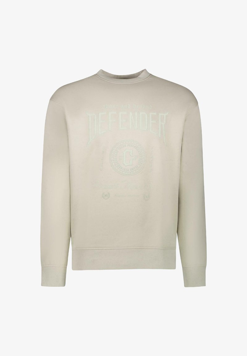 Beige sweatshirt, ronde hals, met reliëftekst "DEFENDER" en circulair logo-detail op de borst. Zachte katoenmix materiaal, geribde manchetten.