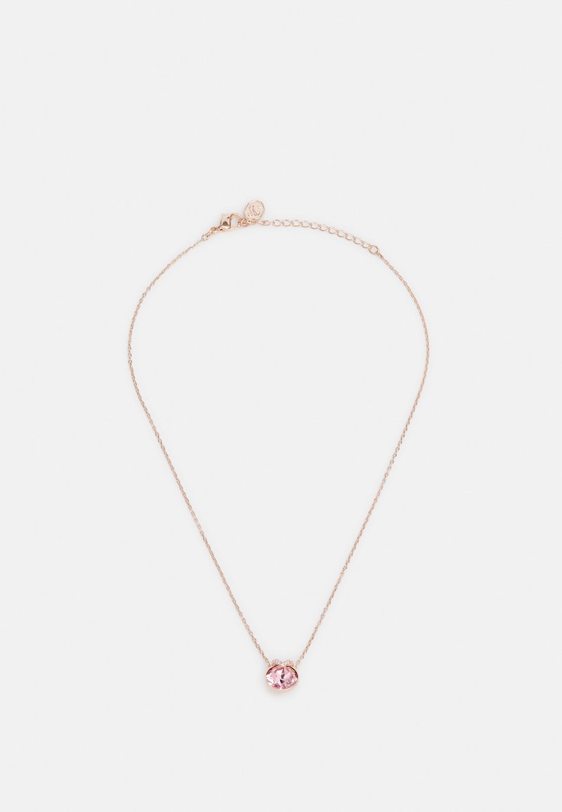 Collier en or rose avec une chaîne délicate et une pierre précieuse rose ronde au centre. Dispose d'un fermoir simple et d'une longueur réglable.