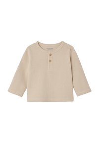 Beige long-sleeve Henley shirt made from textured ribbed material, featuring three buttons on the front and a round neckline.