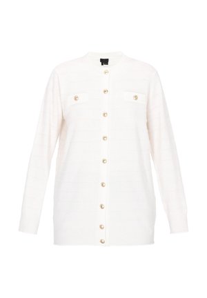 Cárdigan blanco con un patrón texturizado, mangas largas y botones dorados. Presenta dos pequeños bolsillos en el pecho y un neckline redondeado.