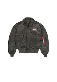 Flight jacket in dark green nylon with a ribbed collar and cuffs, zip front, two front pockets, and a red tag on the left sleeve.
