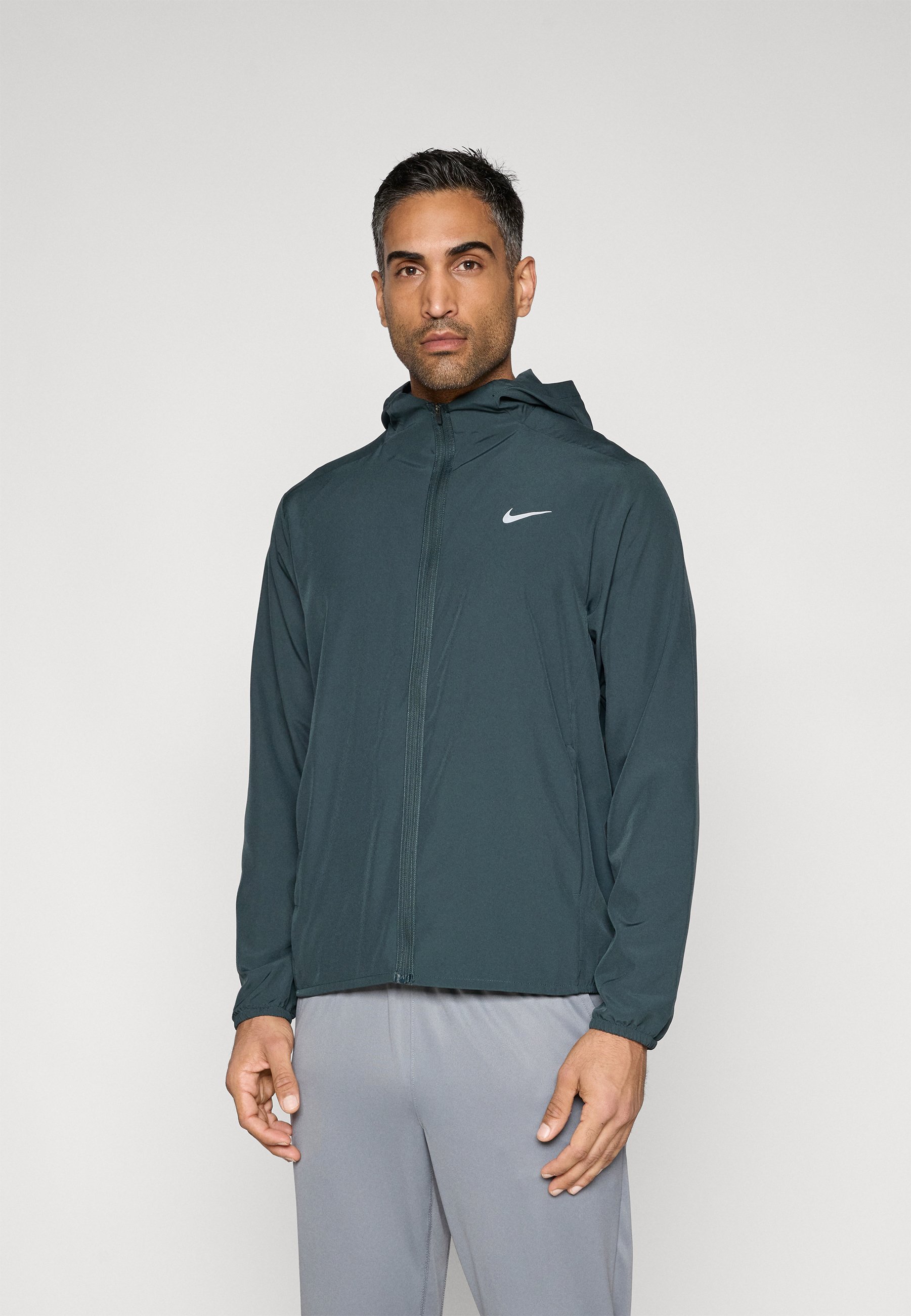 dark green nike windbreaker