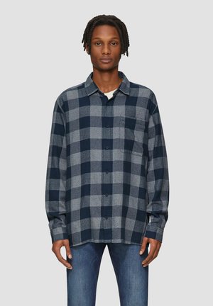 Navy and gray checkered flannel shirt with long sleeves, a button-down front, and pocket on the left chest. Smooth fabric texture.