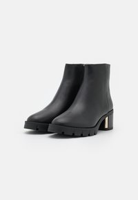 COACH Botines con plataforma - black