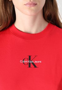 Calvin Klein Jeans MONOLOGO BABY TEE - Marškinėliai su spaudiniu - red