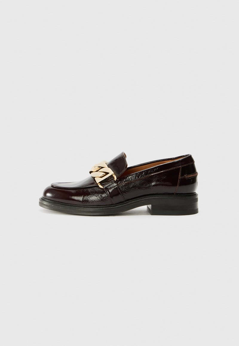 Burgundy patent leather loafers with a rounded toe, embossed detail, and a gold chain accent on the upper. Sturdy black rubber sole.