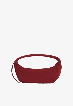 Small crescent-shaped shoulder bag in dark red fabric with a zipper closure and a thin adjustable strap.