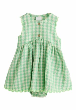 Ärmelloser Baby-Strampler in grün-weißem Vichy-Karo mit wellenförmigen Kanten, vorderen Holzknöpfen und Druckknöpfen am Boden.