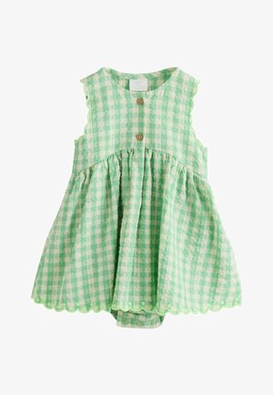 Ärmelloser Baby-Strampler in grün-weißem Vichy-Karo mit wellenförmigen Kanten, vorderen Holzknöpfen und Druckknöpfen am Boden.