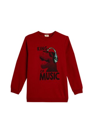 Sudadera roja de manga larga con un gráfico negro de un dinosaurio que lleva auriculares. El texto dice "REY DE LA MÚSICA" en una fuente en negrita.