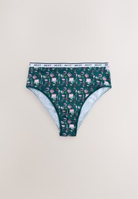 Sous-vêtement féminin vert taille haute avec un motif de gâteaux, cœurs, bougies et boissons, et une ceinture élastique blanche avec l'inscription "NEXT".