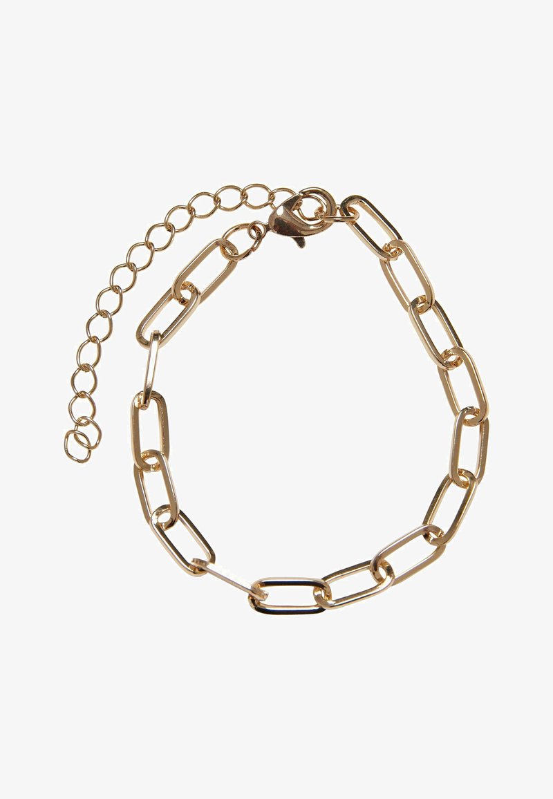 Auksinės spalvos grandinėlė apyrankė su pailgintais jungtimis, krabų sagtimi ir reguliuojama grandinėle dydžio pritaikymui. Lygi, poliruota tekstūra.