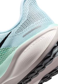 Light blue and green mesh sneaker upper with black accents. Features a textured white midsole and a patterned black outsole for traction.