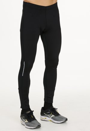 LAUFTIGHTS - Trousers - black