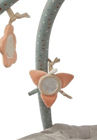 Activity gym with soft, grey base and curved, patterned green arches. Features plush peach-shaped toys and a mirror, made from varied textures.