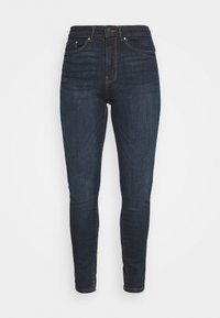 Jeans skinny de mezclilla en azul oscuro, con cintura alta, cinco bolsillos, costuras en contraste y detalles mínimos en hardware.
