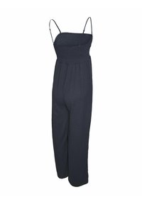 Mörkblå jumpsuit med tunna justerbara remmar, smockad bodice och vida ben. Tillverkad av ett texturerat tyg med veck.