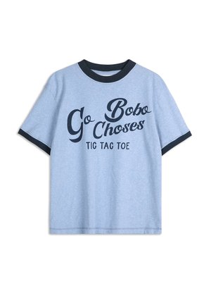 Light blue cotton T-shirt with black ribbed neckline. Front features bold black text "Go Bobo Choses" and "TIC TAC TOE". Short sleeves.
