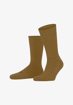 Braune gerippte Socken mit glatter Textur, in mittlerer Wadenhöhe und einem nahe der Zehen aufgedruckten Logo, das ein dezentes Design aufweist.
