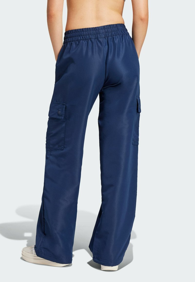 Navy blue cargo pants with a relaxed fit, featuring side pockets and a drawstring waistband, made of smooth, lightweight fabric.