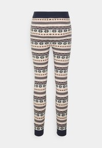 Leggings en tricot à motif navy, beige et blanc avec des flocons de neige et des designs géométriques, taille et poignets côtelés.