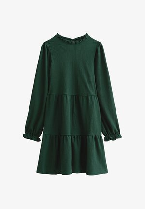 Zielona, teksturowana sukienka z długimi rękawami i falbaniaste wykończenie przy dekolcie. Posiada wielowarstwowy fason oraz elastyczne mankiety zapewniające luźne dopasowanie.